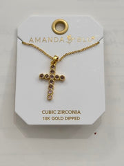 Gold CZ Round Set Pink Cross Necklace in a small circle design on a display card.