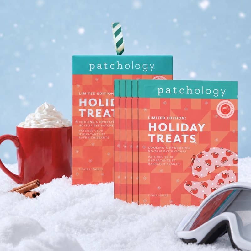 Patchology Holiday Treats limited edition cooling hydrating eye patches displayed in festive winter snow scene