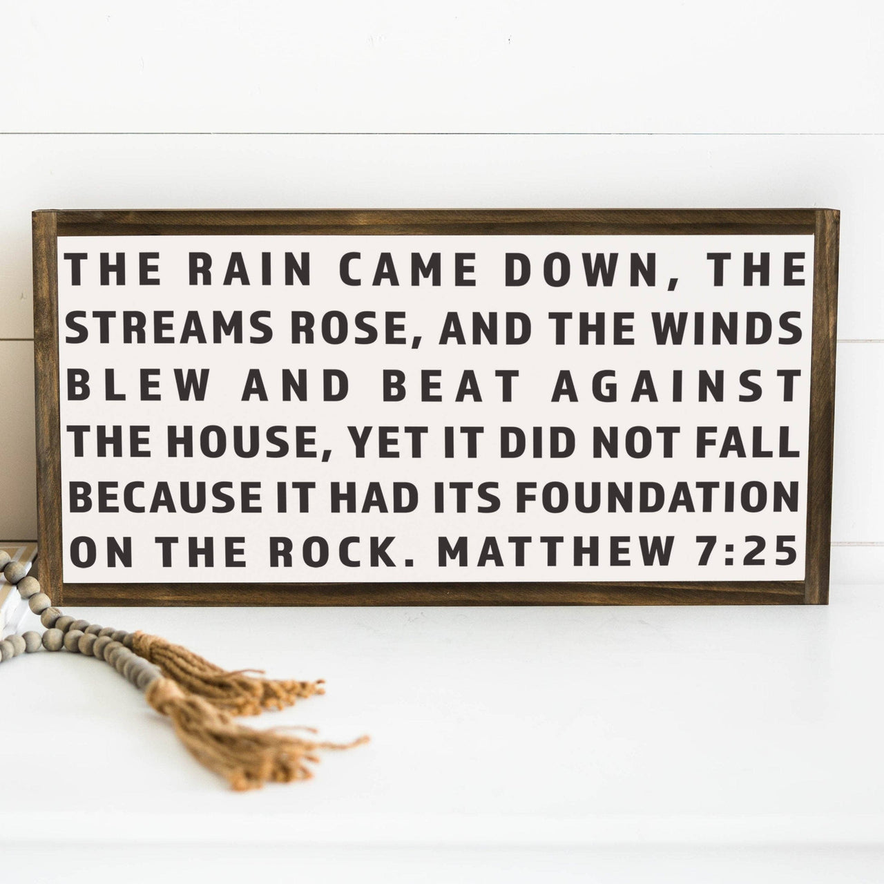 Matthew 7:25: Soft White-Black Text / Dark Brown Frame / 24 inches x 12 inches Joyfully Said