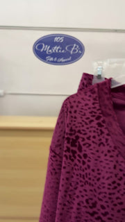 Leopard print lounge pants in a relaxed fit, available in multiple sizes.