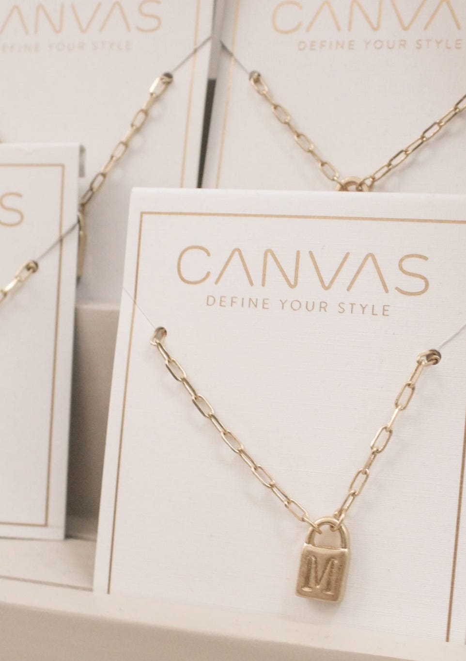 Canvas : Kinsley Padlock Initial Necklace in Worn Gold E